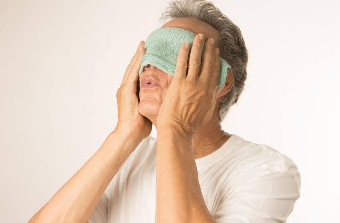 Warm compress for eye irritation 