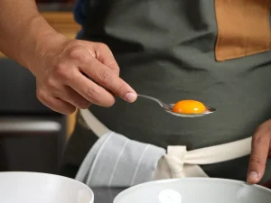 SEPARATING WHITE FROM EGG YOLKS